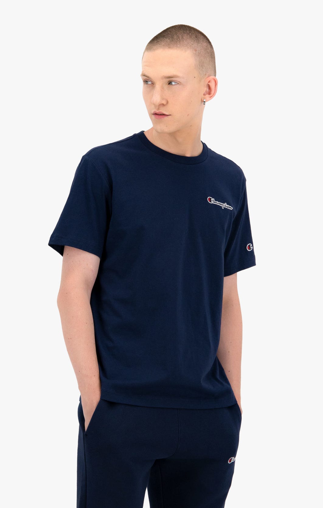 Champion T-Shirt mit Dunkelblau 216480 Schriftzug uscar-world Logo – kleinem